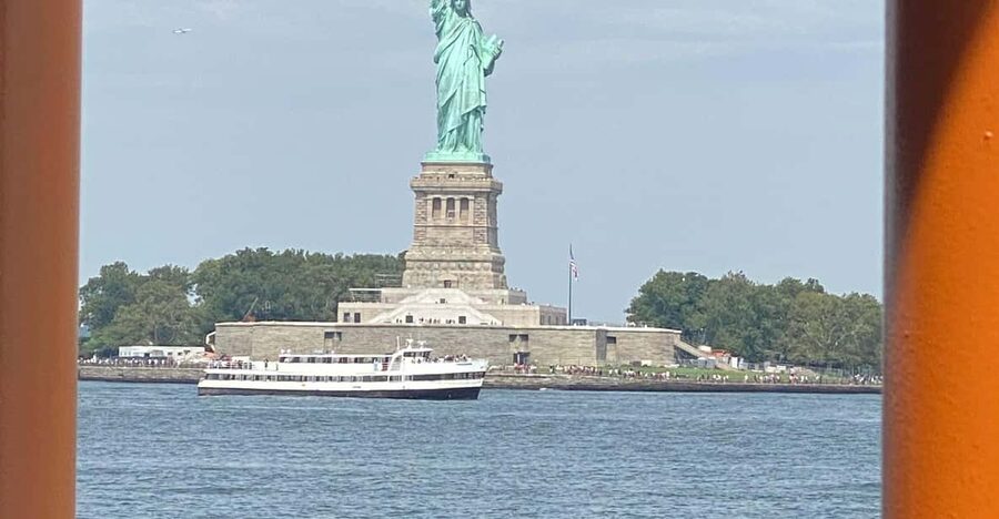 #1 Six Hour Bus Tour and Boat Ride By The Statue of Liberty - Midtown icons from the bus window