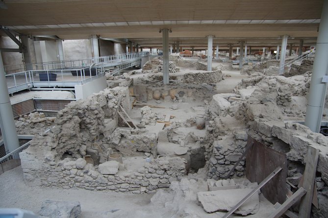 Archaeological Bus Tour To Akrotiri Excavations & Red Beach - The bus, guides, and bilingual commentary