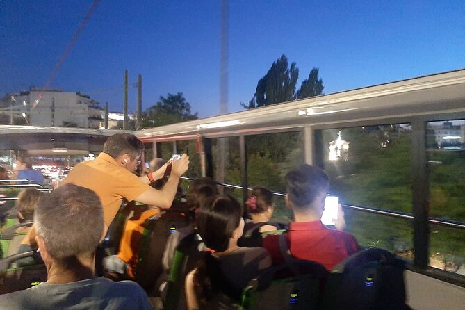 Athens City Night Tour with Open-Top Bus - Seeing Athens switch on after sunset