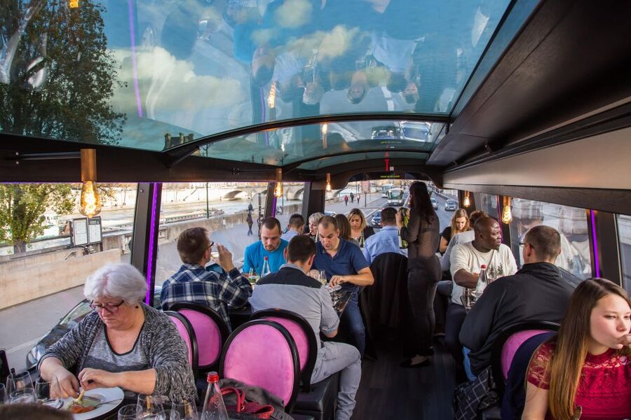 Bus Toqué Champs Elysées Tour w/ 3-Course Dinner & Champagne - Dinner with Paris moving past the windows