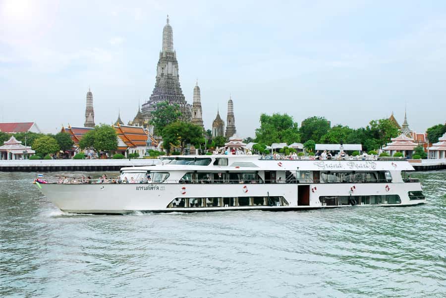 From Bangkok: Ayutthaya Day Tour by Bus with River Cruise - Wat Mahathat and the Buddha head in the roots