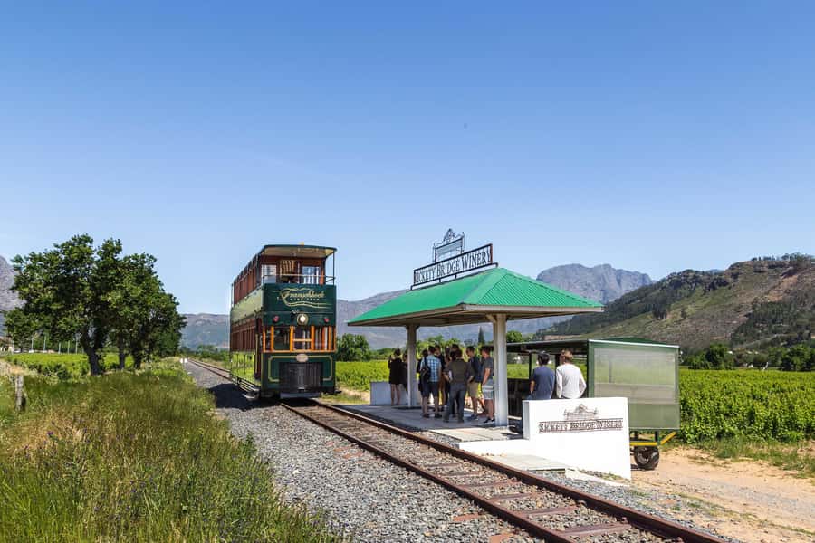 From Cape Town: Franschhoek Wine Tram Hop-on Hop-off - Boarding the tram and open-air buses