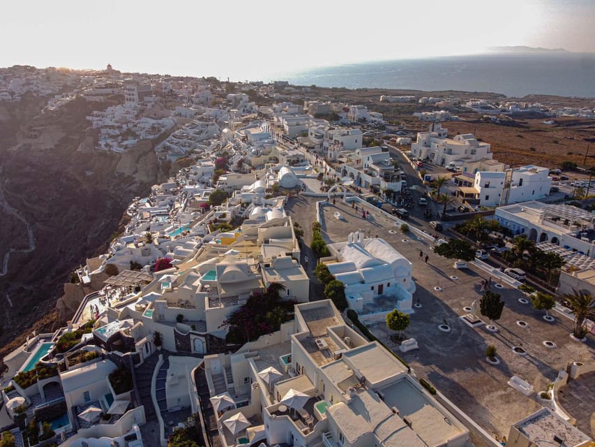 From Fira: Santorini Highlights Minibus Tour with Oia Sunset - The old lighthouse adds a different view of the island
