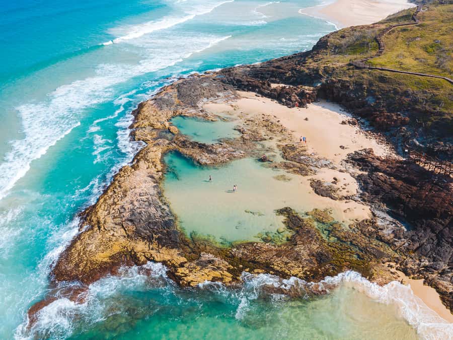 From Hervey Bay: K'gari, Fraser Island Two-Day Coach Tour - Champagne Pools are made for a quick natural soak