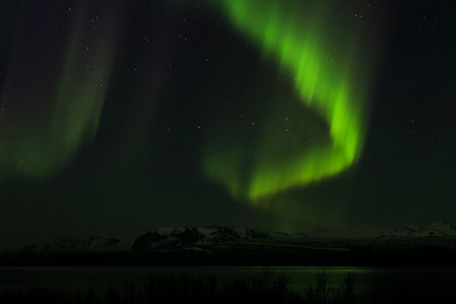 From Reykjavik: Northern Lights Bus Tour with Hot Cocoa - Moving on when the sky changes
