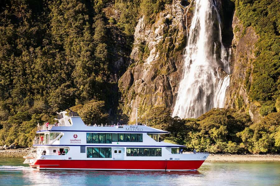 From Te Anau: Milford Sound Cruise & Glass-Roof Coach Tour - Mirror Lakes reward a short photo stop