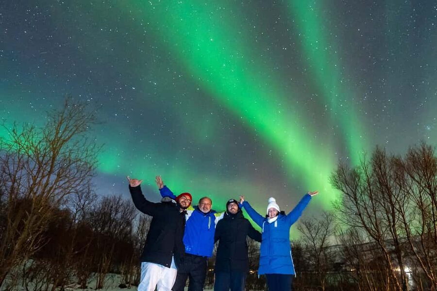 From Tromsø: Aurora Minibus Chase with Portrait and Hot Meal - Meeting at Ami Hotel and getting ready for the Arctic