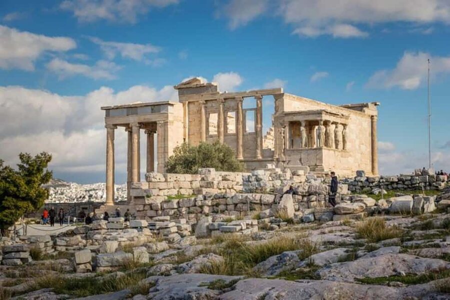 Guided walking tour of Acropolis with bus city tour - Walking through the Acropolis entrance