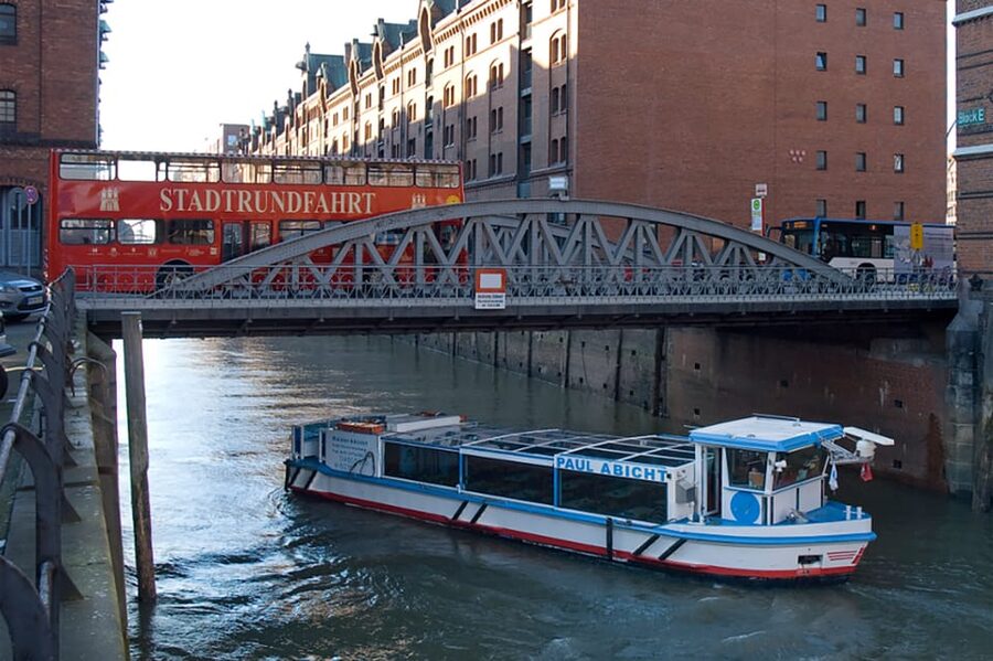 Hamburg: Harbor Cruise and Bus City Hop-On Hop-Off Tour - Speicherstadt, brick warehouses, and modern port views
