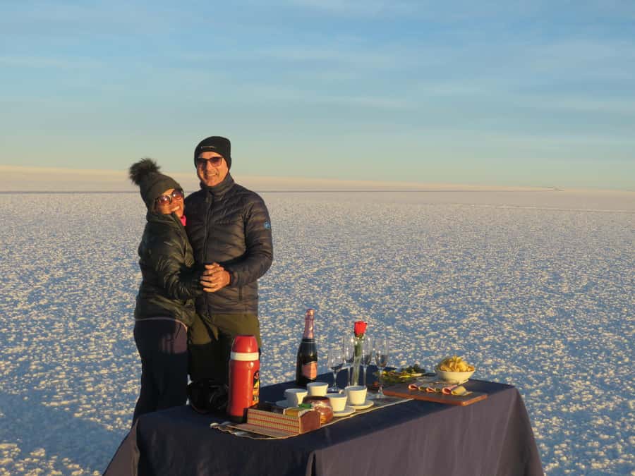 La Paz: Uyuni Salt Flats Tour by Bus - Sunset with wine, snacks, and warm tea