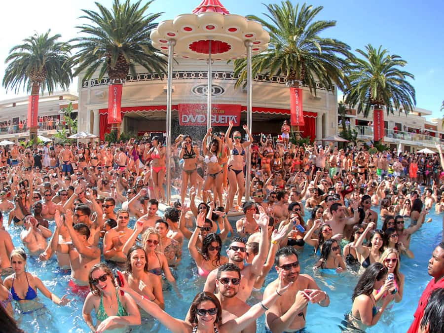 Las Vegas: Famous Pool Party Tour with Party Bus & Drinks - Fast-pass entry at two pool parties