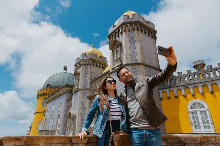 Lisbon: MiniBus Sintra, Pena, Regaleira, Cap Roca Tour - Pena Palace: color, symbols, and hilltop views
