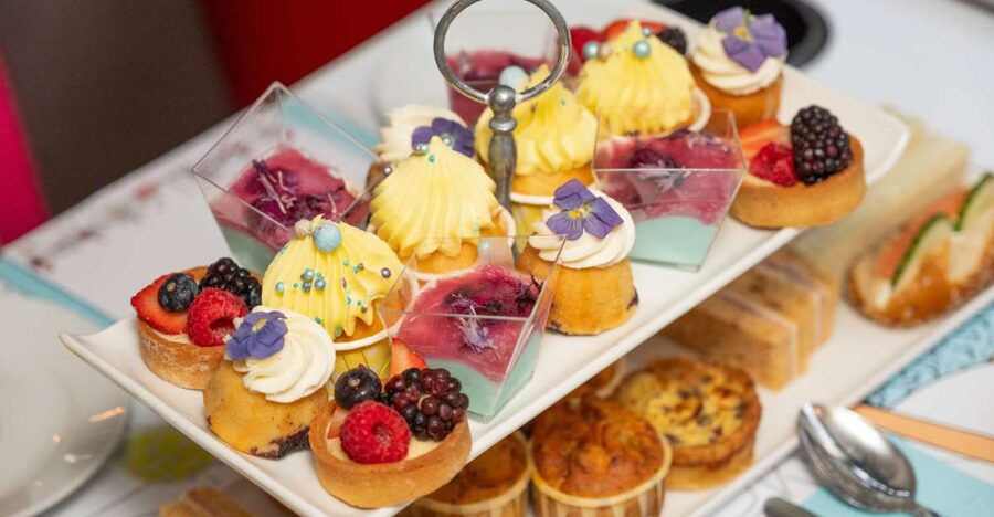 London: Gin and Afternoon Tea Bus Tour with Audio Guide - A moving view of the London Eye and Westminster