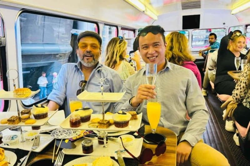 London: "Here We Go Again" Afternoon Tea Bus - Finding the pink-striped bus at Golden Tours Stop 1