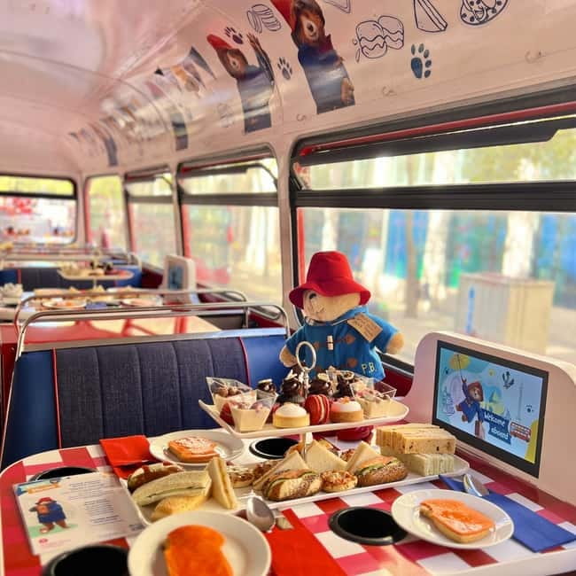 London: Paddington Bear Themed - Afternoon Tea Bus Tour - Paddington and Mrs. Bird keep children listening