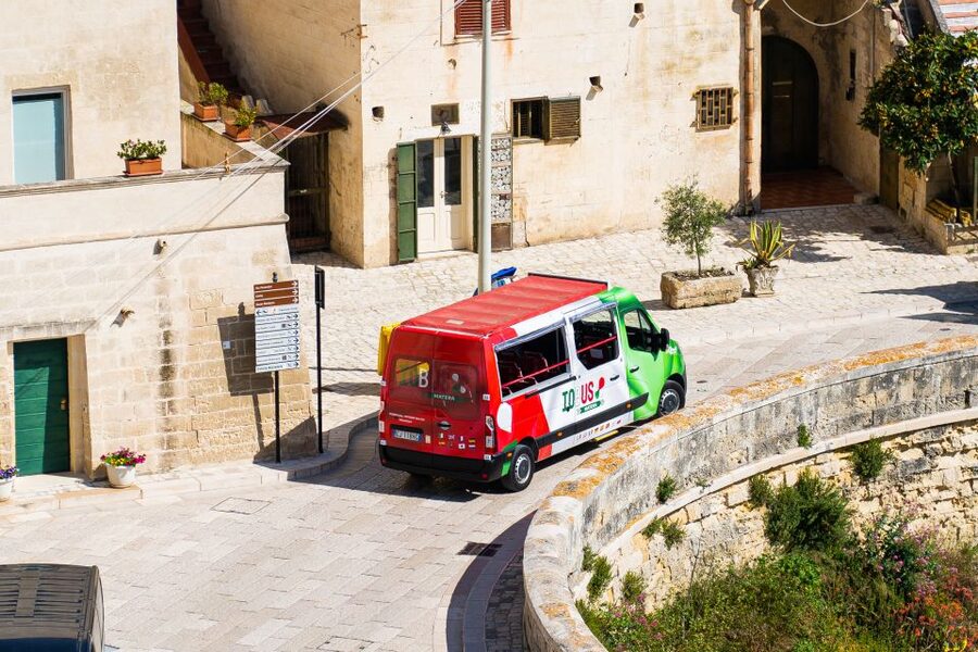 Matera: Open Top Bus Tour with Entrance to Casa Grotta - Piazza San Pietro Caveoso after dark