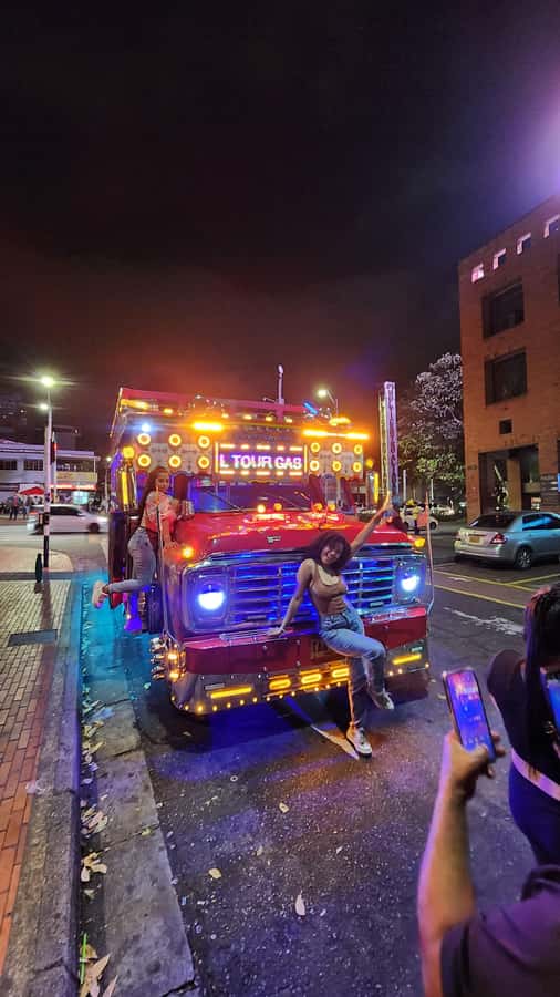 Medellin: Party Bus with DJ & Street Food Tastings - A party bus that begins before dinner