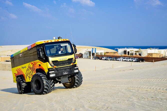 Monster Bus desert adventure: Dune bashing and sandboarding - Sealine’s desert and sea meeting point