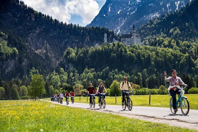 Munich: Neuschwanstein Castle by Bus with Alpine Bike Ride - A summer swim with a castle view