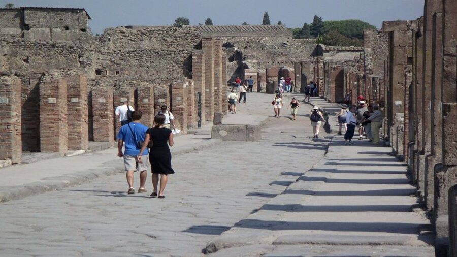 Pompeii Half-Day Coach Tour from Sorrento - Entering Pompeii with a guide