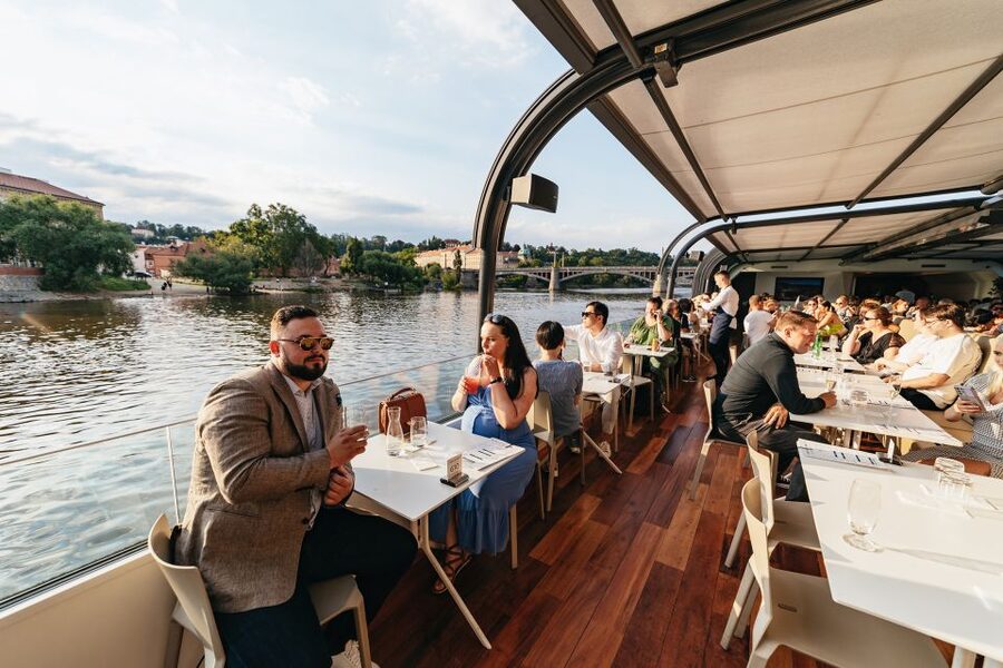 Prague: Sightseeing Dinner Cruise on Open-Top Glass Boat - Music and the mood onboard