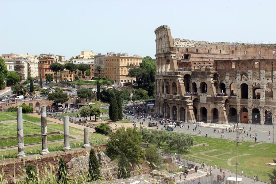 Rome: Hop-On Hop-Off Bus, Roman Forum & Colosseum Tour - Entering the Colosseum with a guide