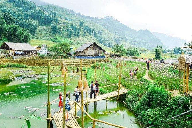 Sapa 2 Days 1 night By Bus/Train - Overnight in Hotel 3</em> With Mountain View – What this Sapa trip is really about’ /></p>
<p><p>This is a compact introduction to Sapa, not a slow rural retreat. In two days, you travel from Hanoi to the mountains, visit Cat Cat Village, spend a night in town, walk through several ethnic villages, and return by bus the next evening.</p>
</p>
<p><p>The strongest part is the second day. The route from Y Linh Ho to Lao Chai and Ta Van follows rice terraces and the Muong Hoa Stream, giving you a clearer sense of how Sapa’s villages fit together. You are not just stopping for a photograph. You are walking through the fields and seeing the slopes used for rice cultivation.</p>
</p>
<p><p>The tour also explains the farming cycle, from sowing the seed to harvesting and serving rice at the table. That detail gives the terraces a practical meaning. They are not simply pretty steps cut into the hills. They are working farmland that supports local communities.</p>
</p>
<p><p>The night is in a hotel, not in a traditional village homestay. The program describes Ta Van as the home of the Dzay people, but your overnight base is in Sapa town. That makes the trip easier for anyone who wants a private hotel room and normal facilities, though it offers less direct contact with village life after dark.</p>
</p>
<div class="twil" style="margin: 20px 0; padding: 15px 0;"><p>More Train Trips in Hanoi:</p><ul style="margin: 10px 0; padding-left: 0; list-style: none;"><li style="margin: 0 0 12px 0; padding: 0 0 12px 0; border-bottom: 1px solid #DDEAE5; line-height: 1.4;"><a href="https://busdaytrips.com/hanoi-city-tour-bat-trang-train-street-lunch-luxury-bus/">Hanoi City Tour: Bat Trang, Train Street, Lunch & Luxury Bus</a><br><span style="font-size: 0.82em; color: #555;"><span style="color: #FFC200;">★</span> 4.9 &nbsp;&middot;&nbsp; 15 reviews</span></li><li style="margin: 0 0 12px 0; padding: 0 0 12px 0; border-bottom: 1px solid #DDEAE5; line-height: 1.4;"><a href="https://busdaytrips.com/1-day-1-2-day-hanoi-city-luxury-bus-lunch-train-street/">1 Day – 1/2 Day Hanoi City – Luxury Bus, Lunch, Train Street</a><br><span style="font-size: 0.82em; color: #555;"><span style="color: #FFC200;">★</span> 4.9 &nbsp;&middot;&nbsp; 8 reviews</span></li><li style="margin: 0; padding: 0; border-bottom: none; line-height: 1.4;"><a href="https://busdaytrips.com/explore-sa-pa-with-overnight-train-sleeper-bus-trekking/">Explore Sa Pa with Overnight Train & Sleeper Bus & Trekking</a><br><span style="font-size: 0.82em; color: #555;"><span style="color: #FFC200;">★</span> 3.9 &nbsp;&middot;&nbsp; 7 reviews</span></li></ul></div><h2>Leaving Hanoi early for Sapa</h2>
<p><img width="669" height="446" decoding="async" src=