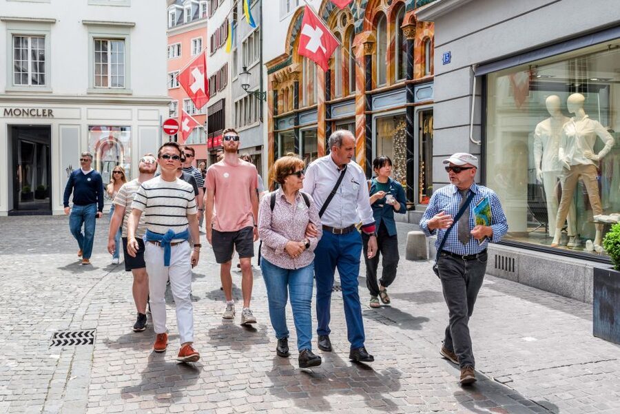 Zurich: City Highlights Tour by Bus, Cable Car, and Ferry - Old Town churches, guild houses, and the Limmat
