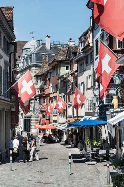 Zurich: Open Top Bus Sightseeing Tour with Optional Cruise - What the optional Lake Zurich cruise adds